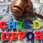 Child Support letters with gavel and cash Child Support letters with gavel and cash